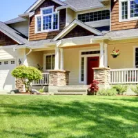 House with healthy green lawn